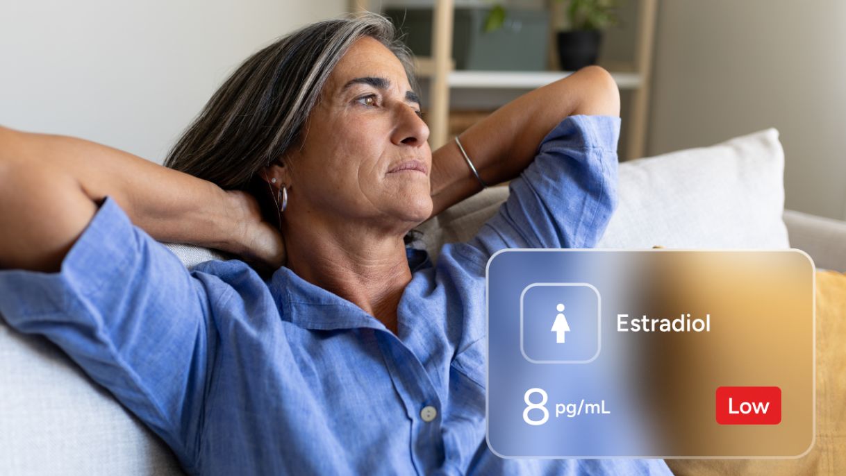 older woman relaxing with hands behind head