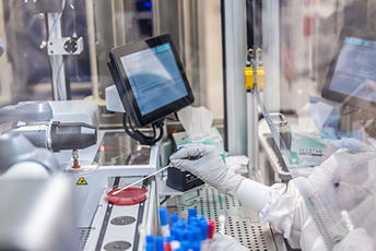 Image of lab technician running a sample