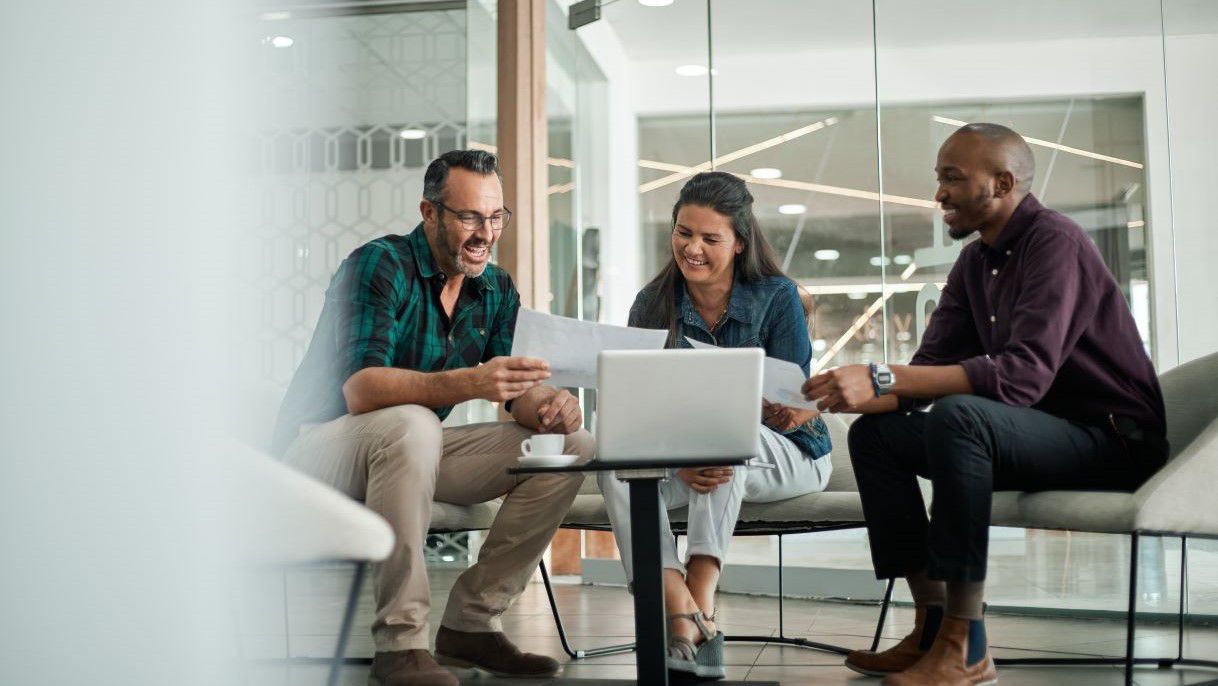 3 colleagues discussing data and benefits