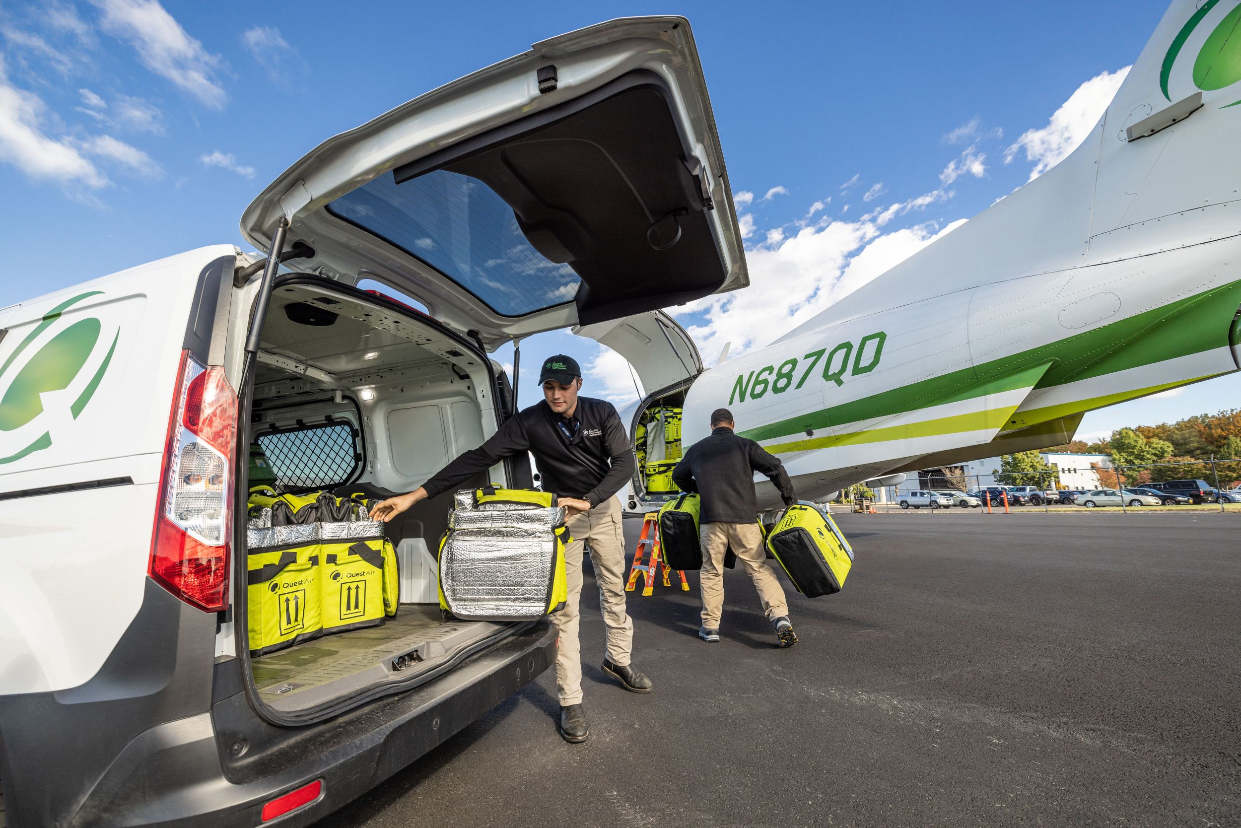 Quest pilot and RSR unloading plane in Manassas, VA