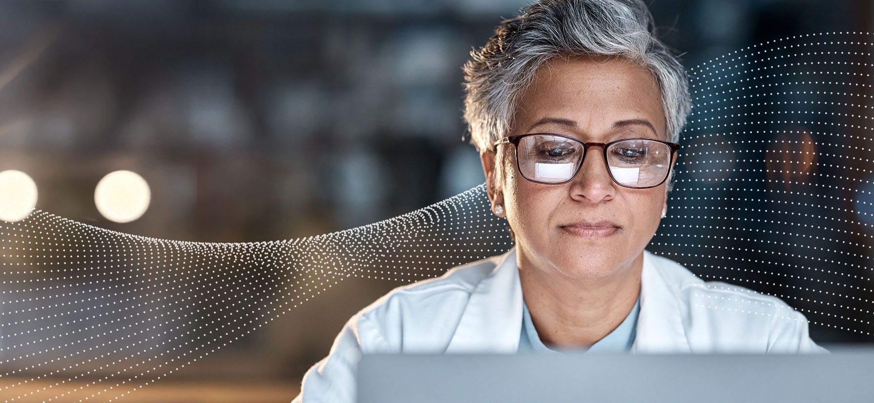 Doctor focused on laptop
