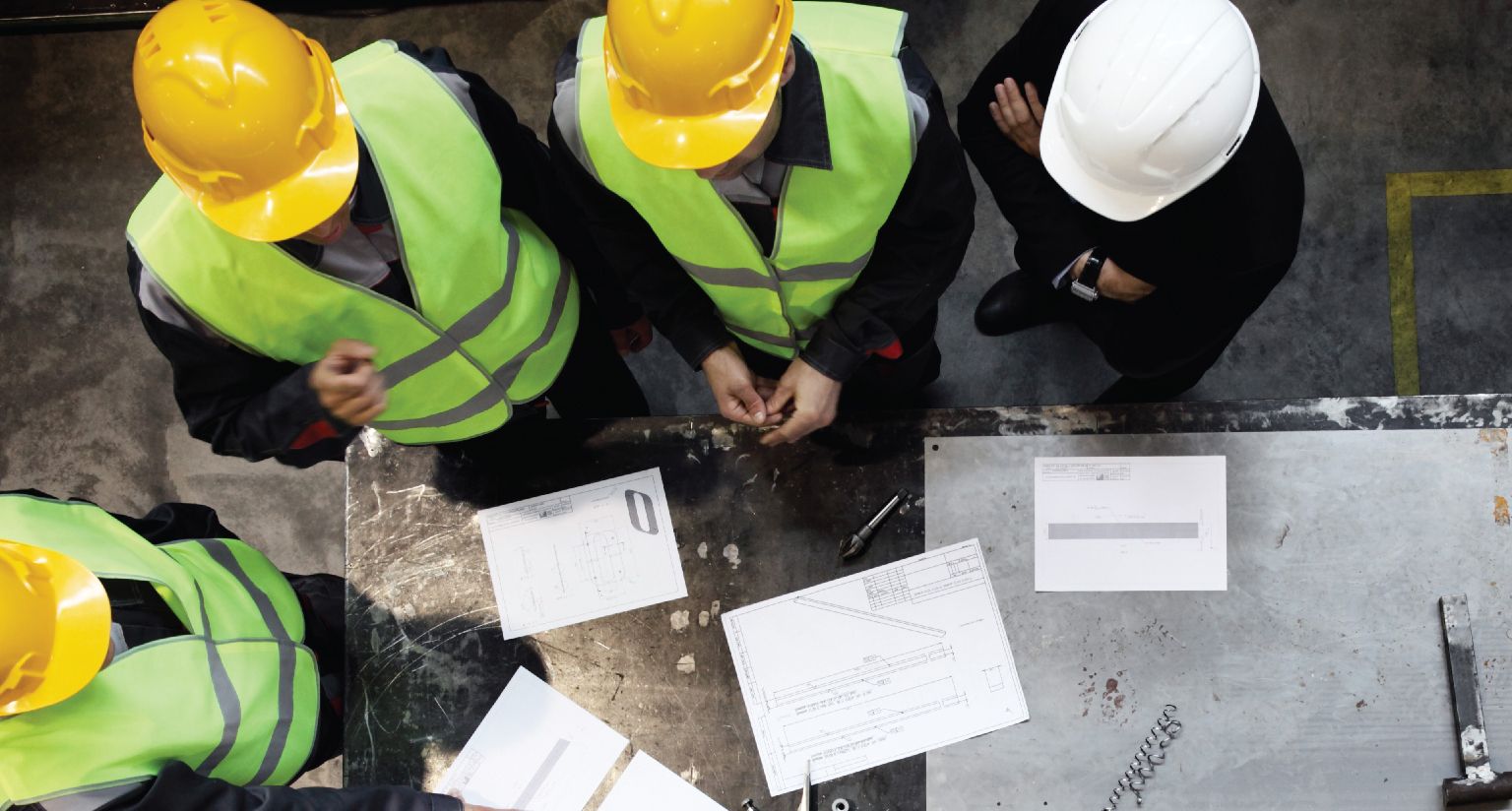 construction workers discussing plans