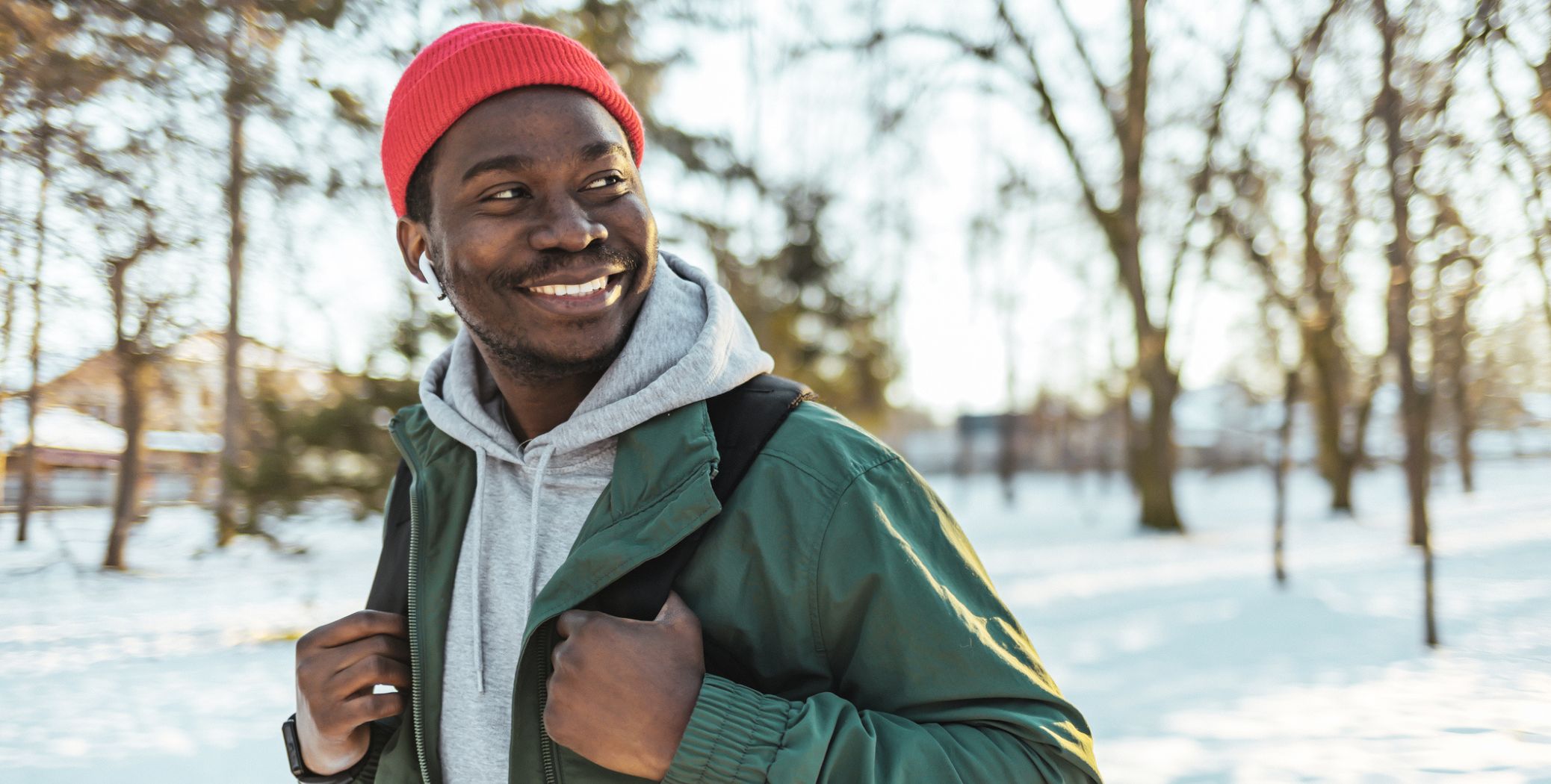 Man wearing backpack in snow