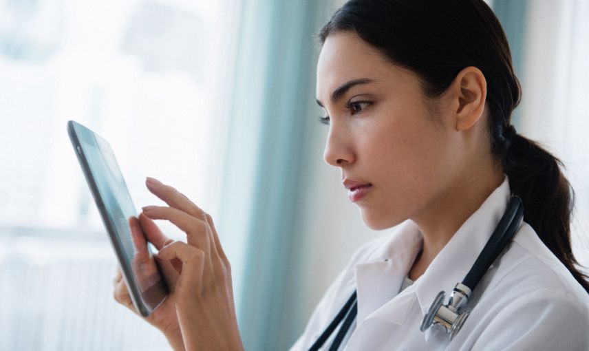 female doctor on ipad