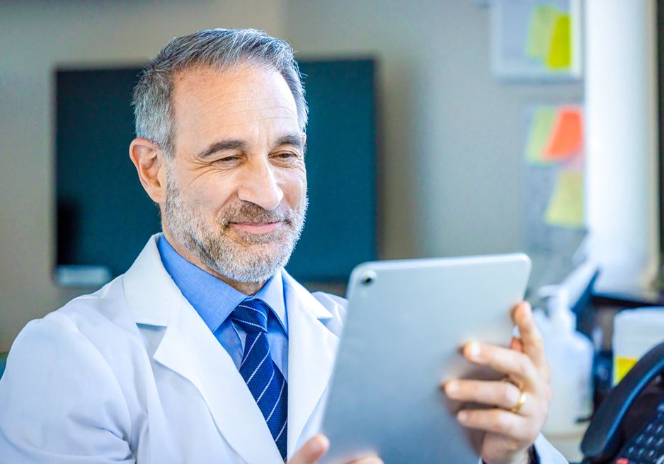 Doctor looking at ipad