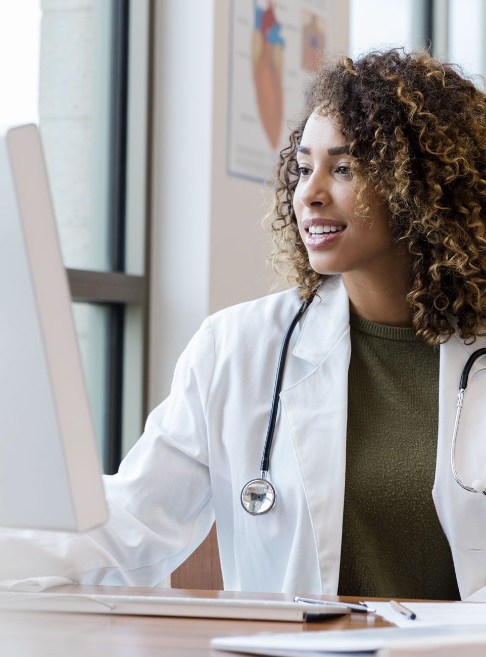 female doctor on computer