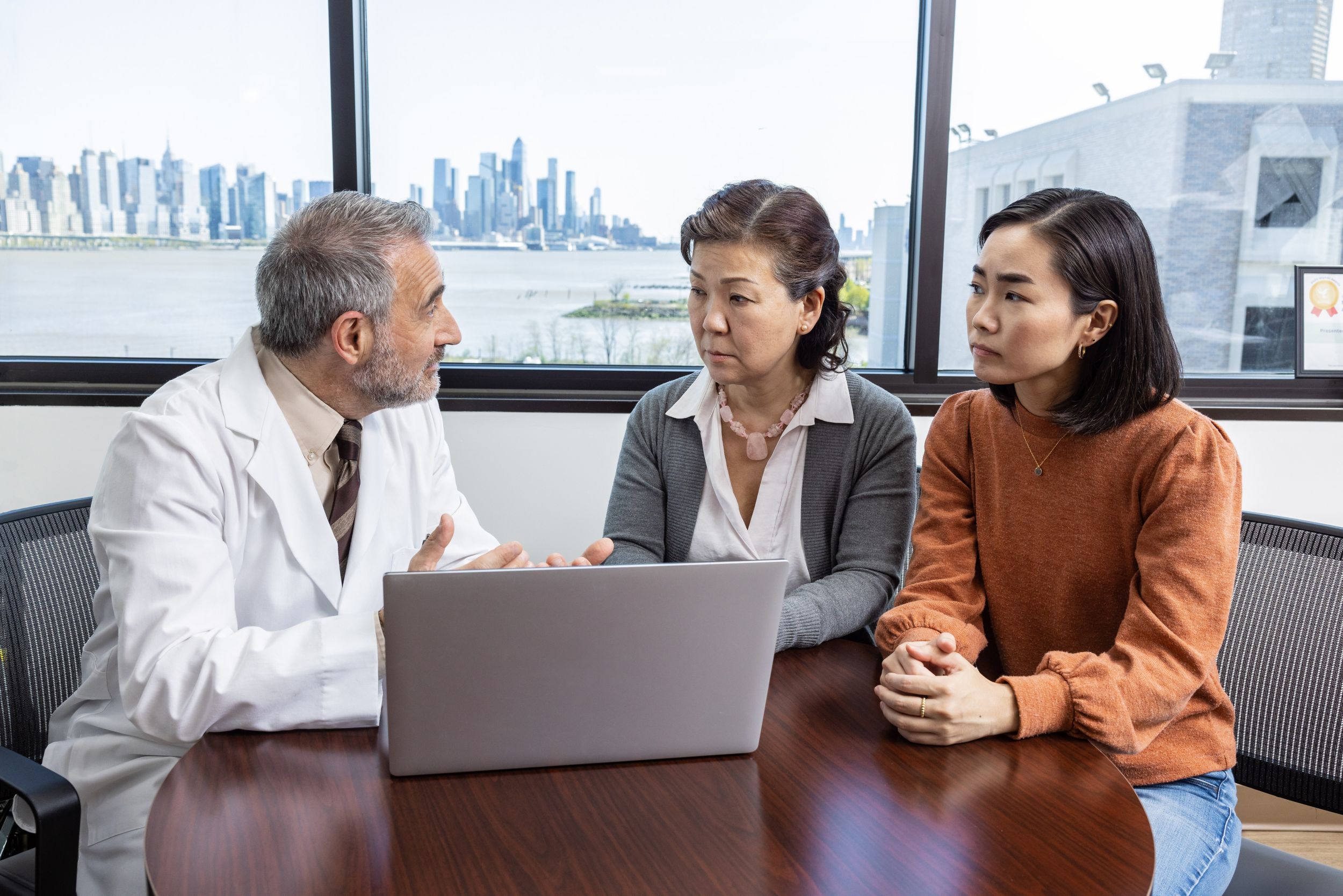 Physician speaking with two women