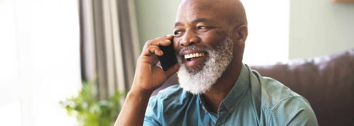Senior bearded man on phone