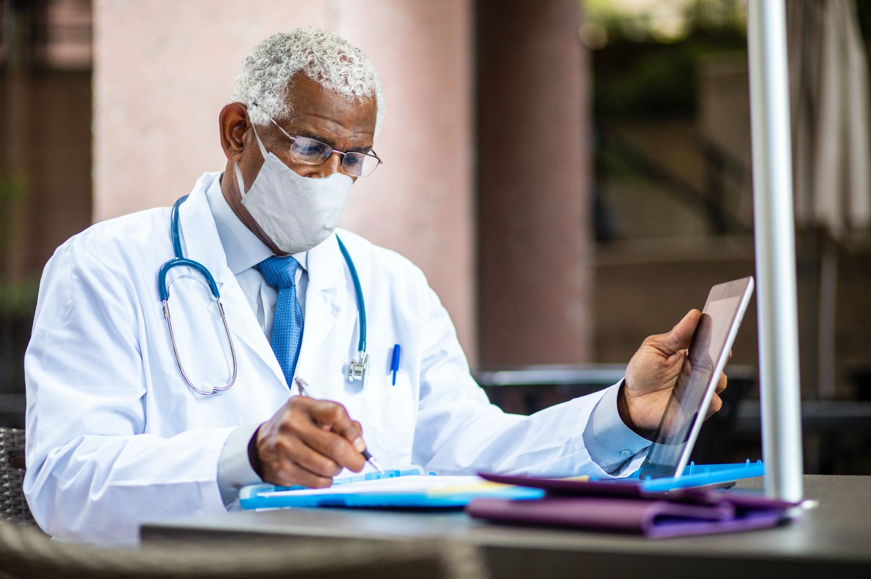 doctor writing notes