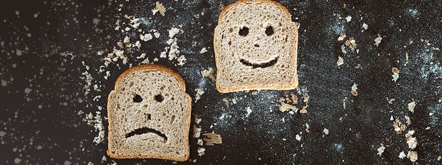 Slices of bread with faces cut into them