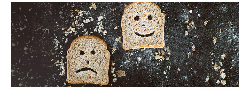 Slices of bread with faces cut into them