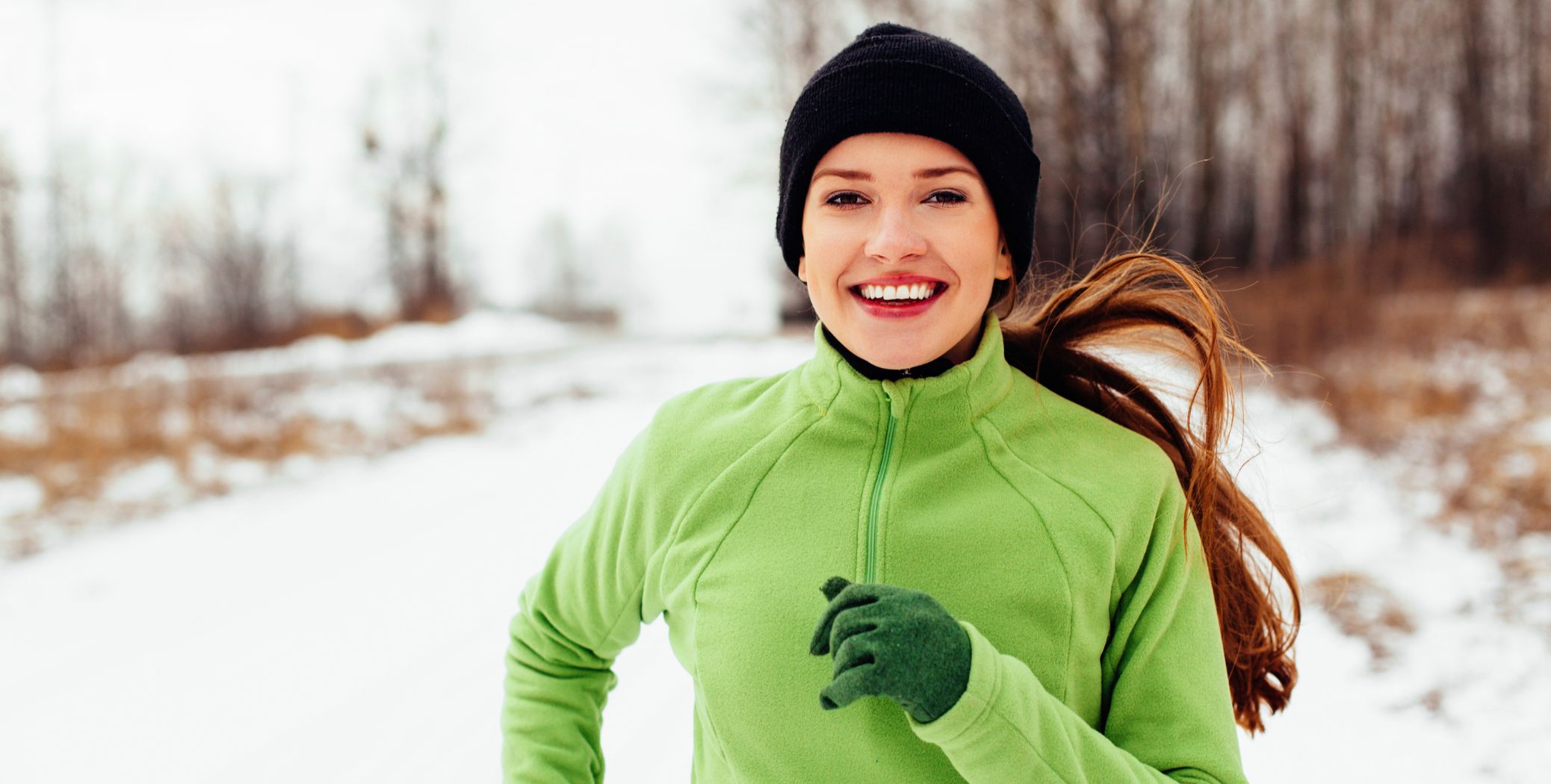 Woman running in the snow 