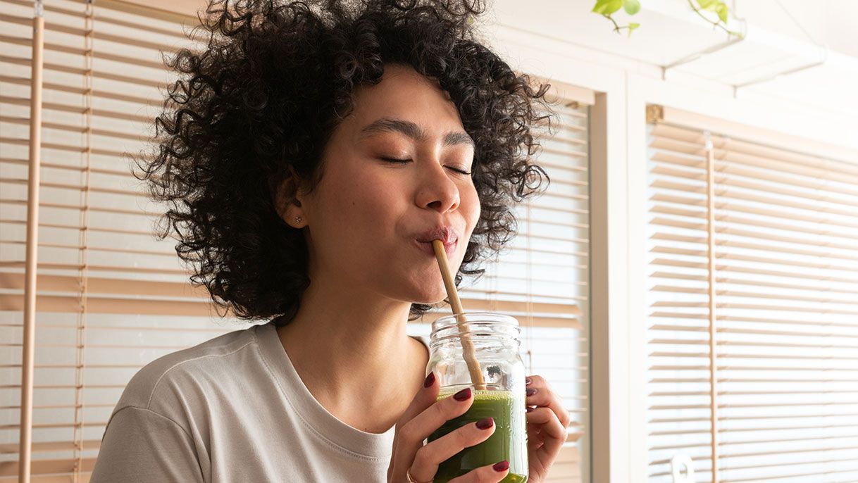 woman sipping juice